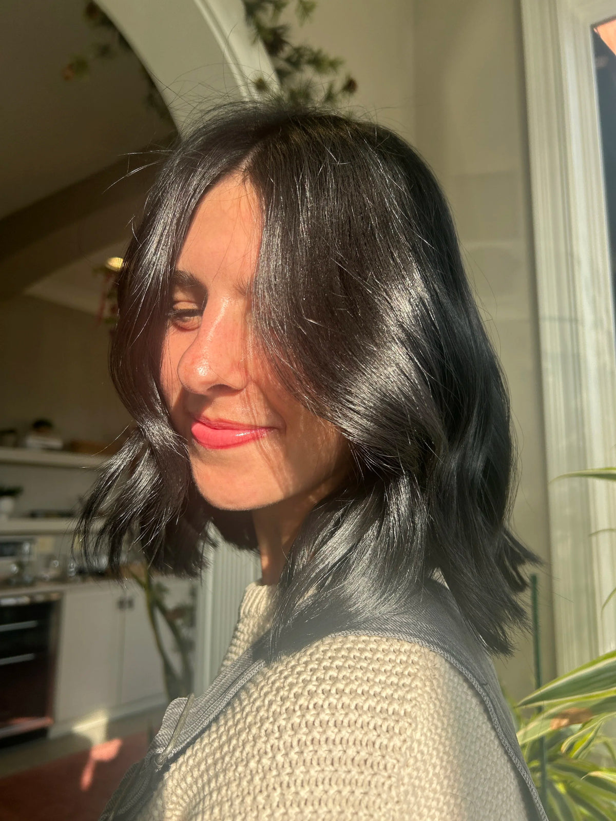 Smooth, shiny dark hair with a polished finish