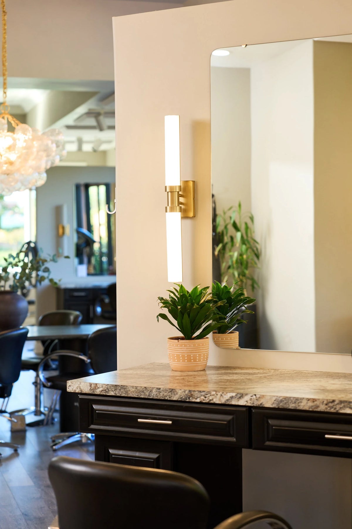 Styling station with a mirror and warm lighting